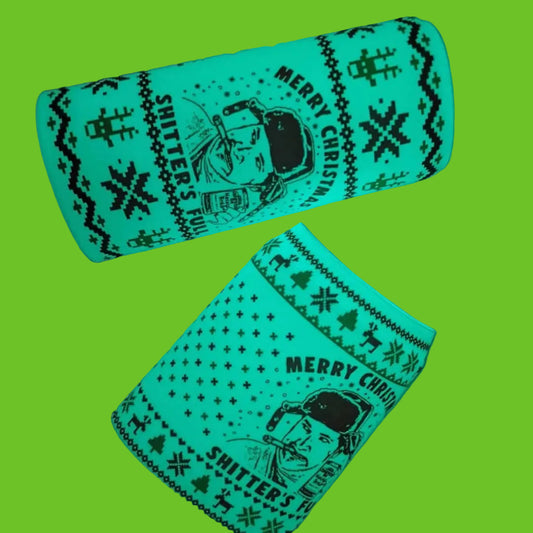 Glowing green Christmas-themed bottle cover with text and graphics on a dark background