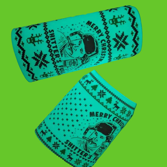 Glowing green Christmas-themed bottle cover with text and graphics on a dark background