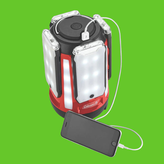 Red and black Coleman lantern with USB cable on a white background