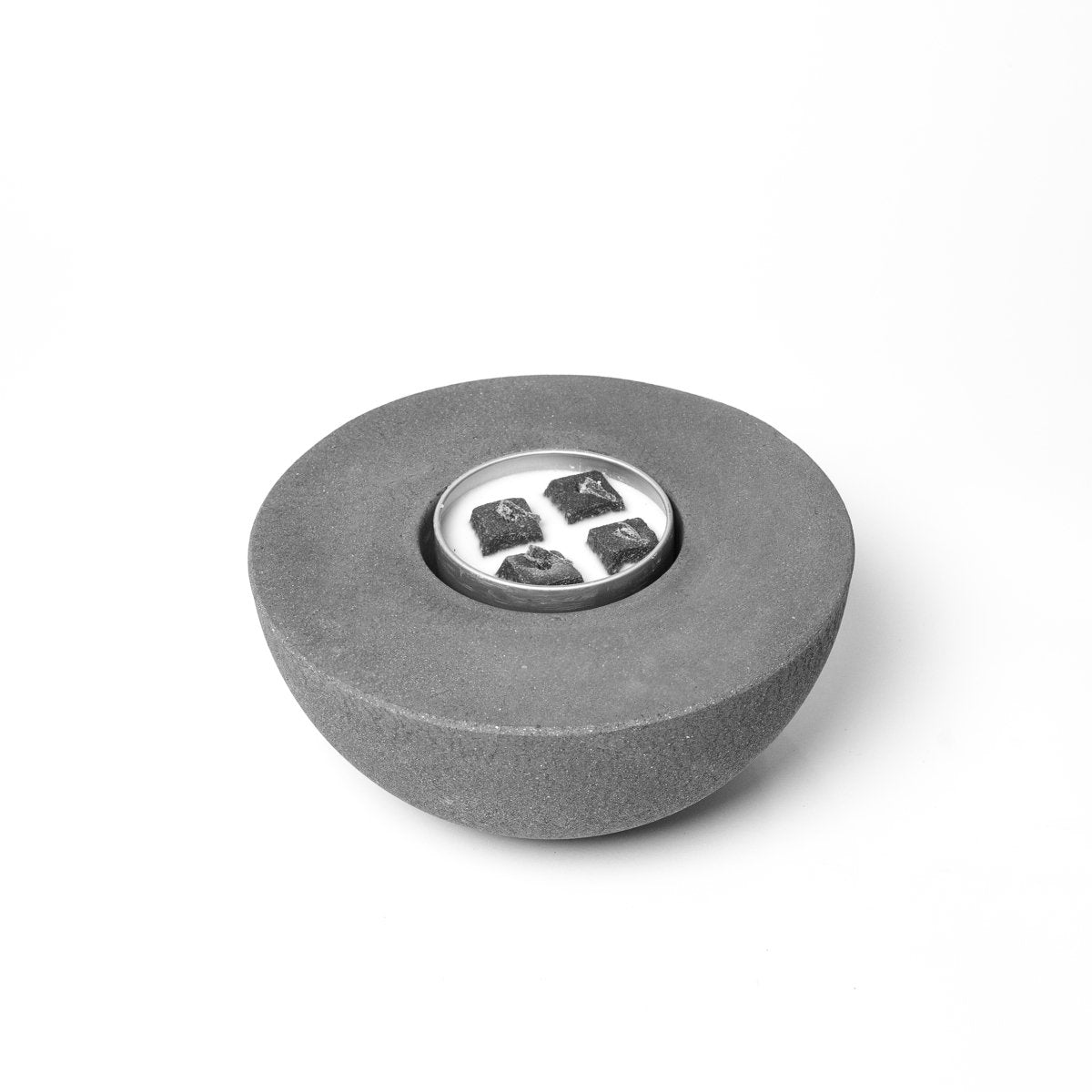 Gray stone-like object with a central circular design on a white background