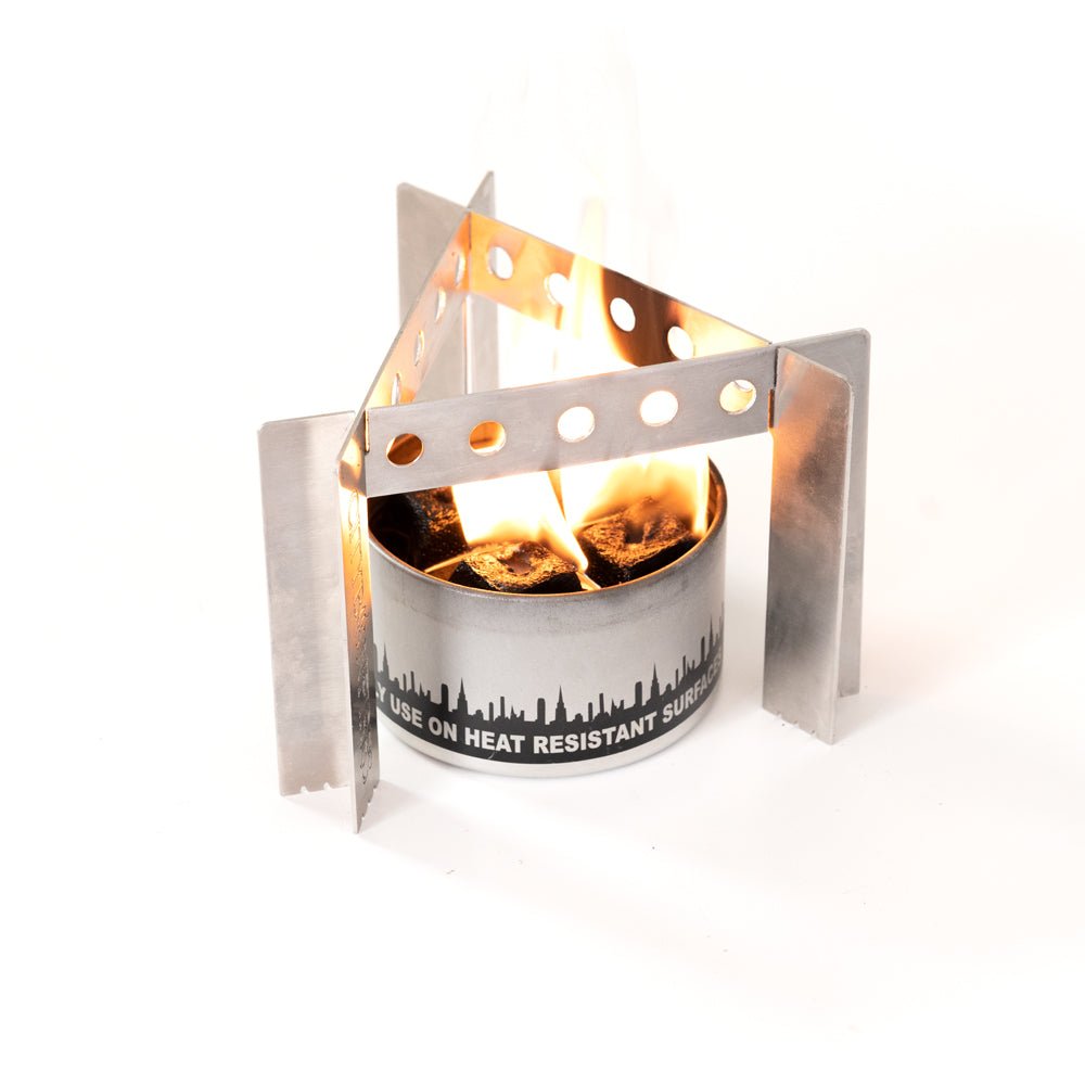 Metal fire pit with flames on a white background