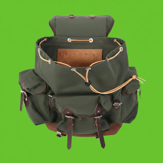 Green backpack with brown leather straps on a white background