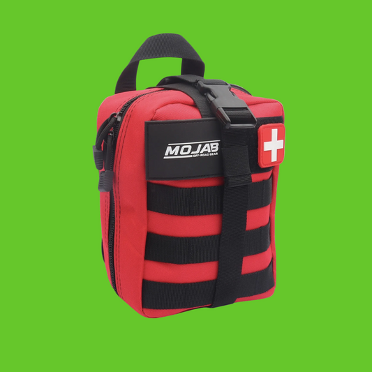 Red and black first aid kit with 'MOJAB' branding on a green background