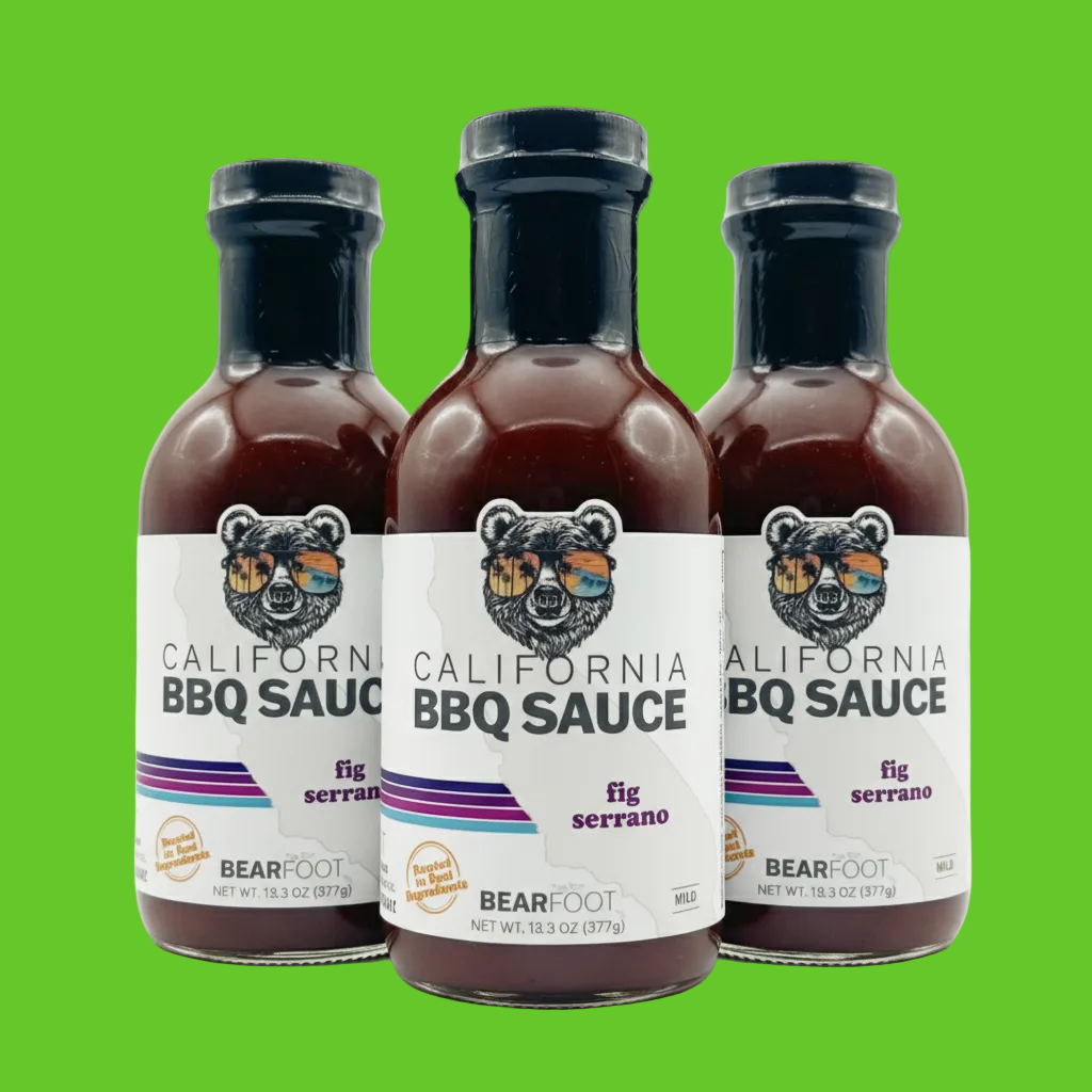 Three bottles of Bearfoot California BBQ Sauce with fig serrano flavor on a white background