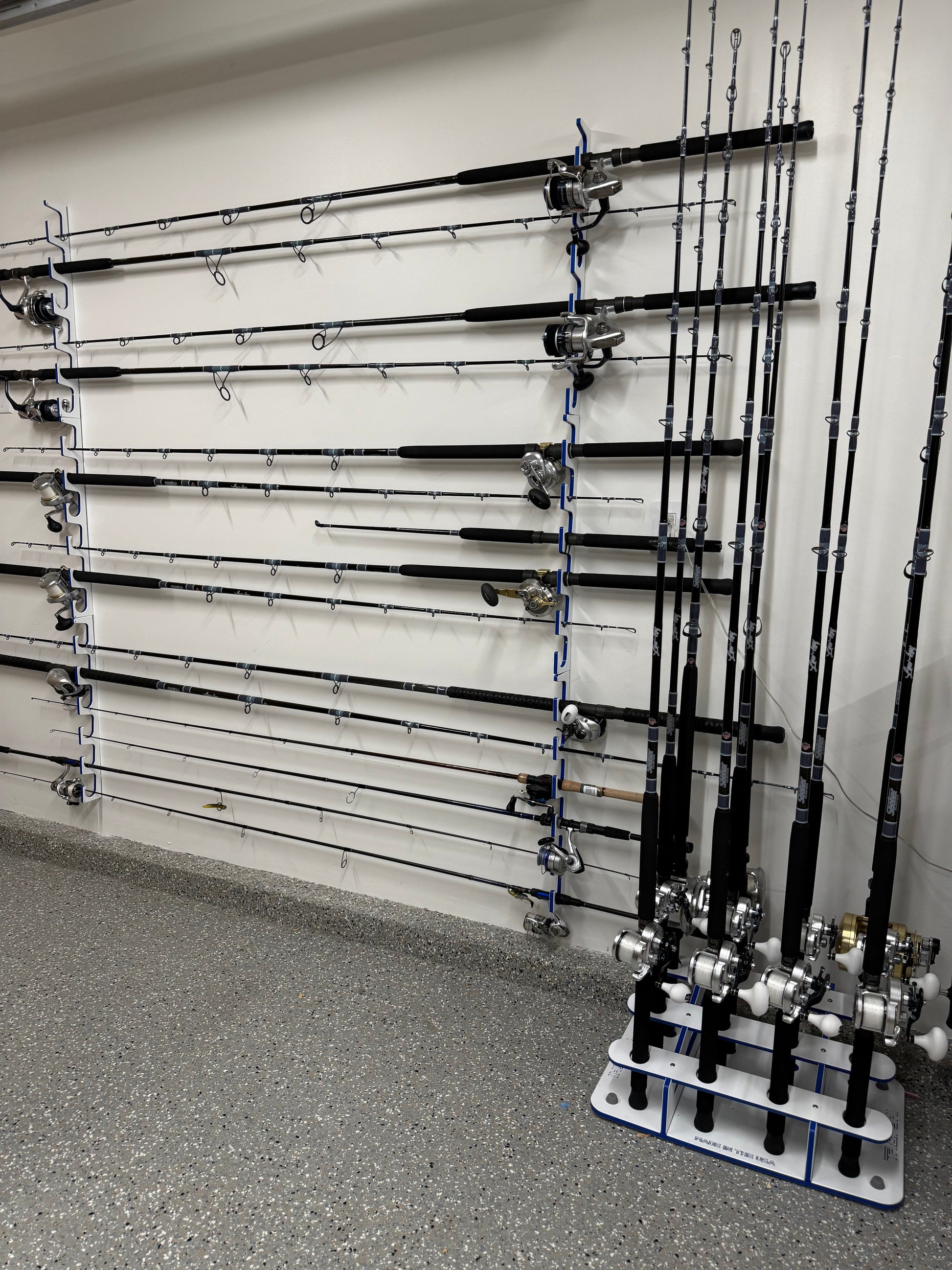 Fishing rods on a wall-mounted rack in a garage setting
