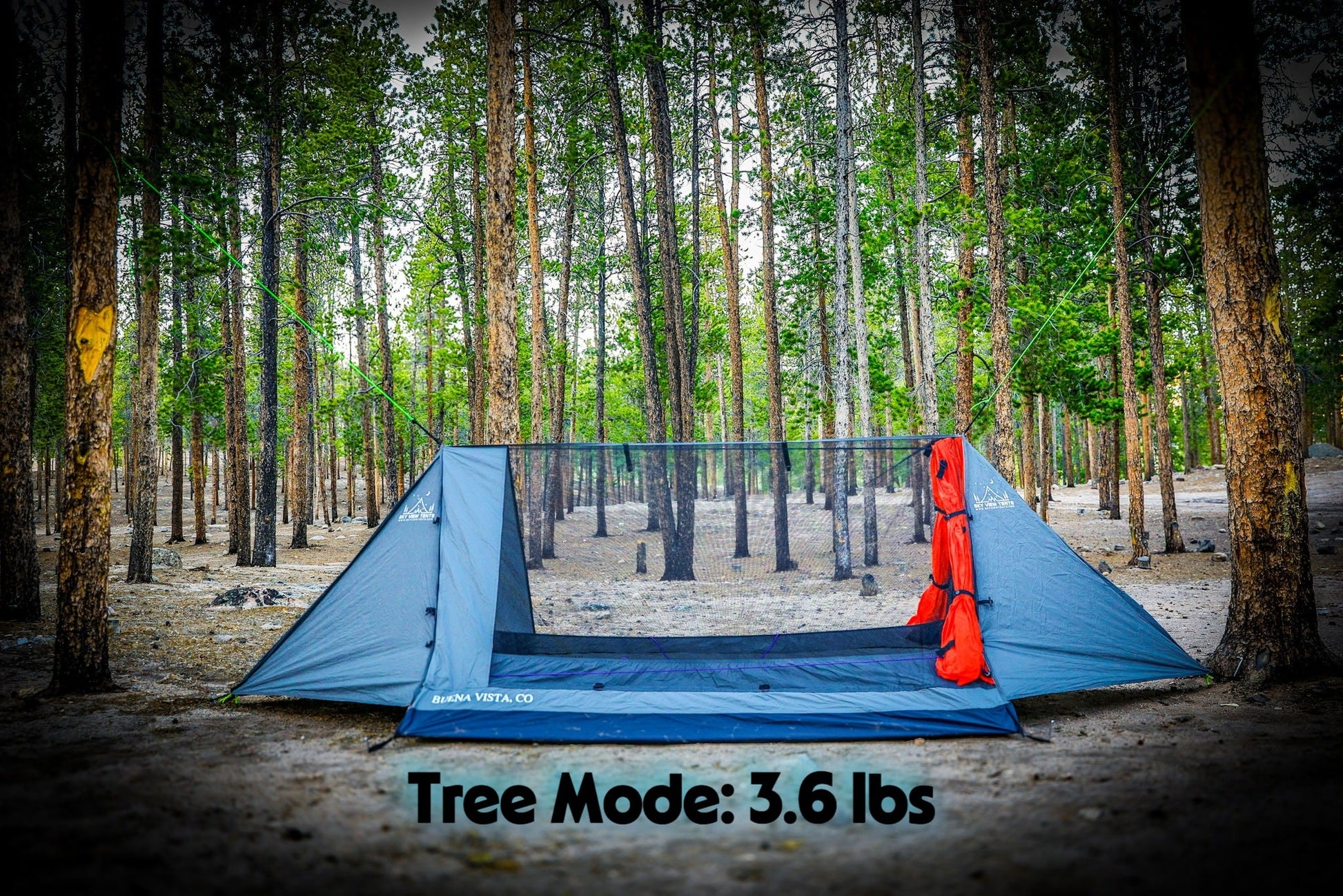 Blue camping tent in a forest with 'Tree Mode: 3.6 lbs' text.