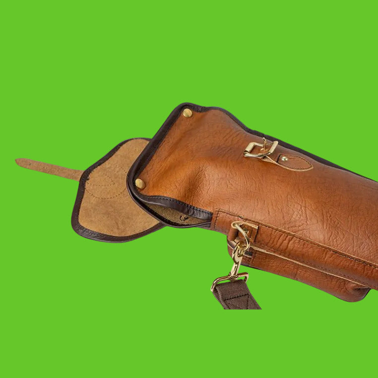 Brown leather bag with gold accents on a white background