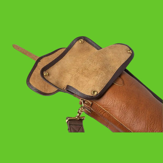 Brown leather bag with a strap and decorative element on a white background