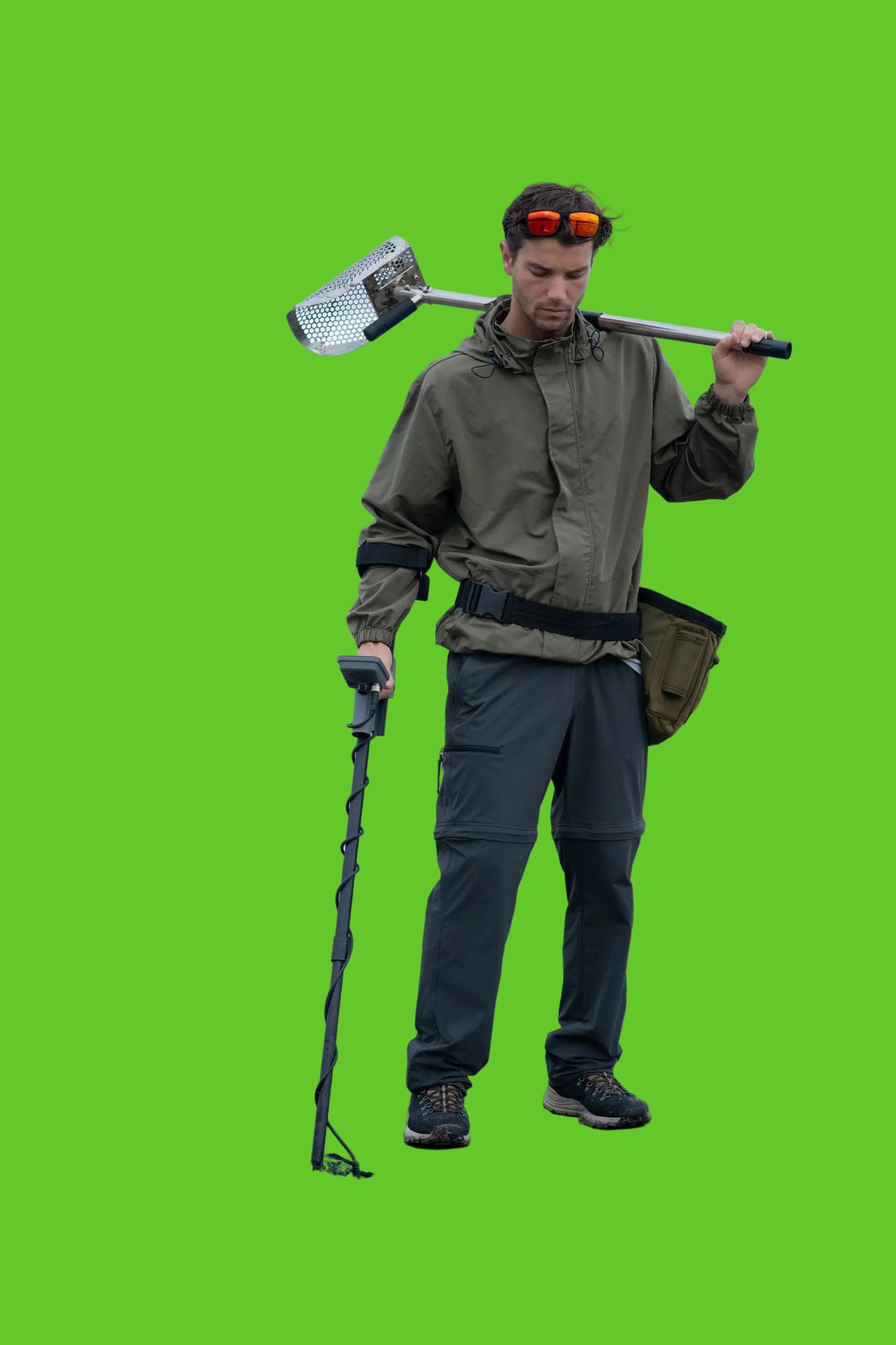 Person with metal detector and shovel 