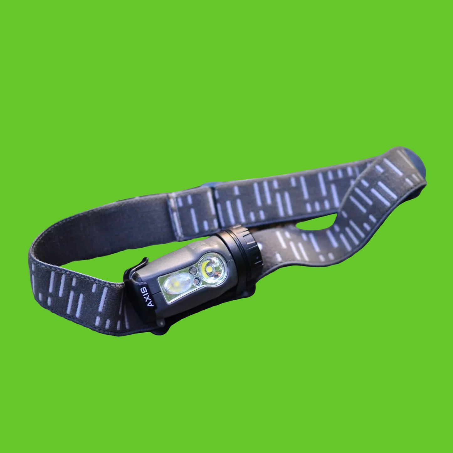 Headlamp with strap on a rock