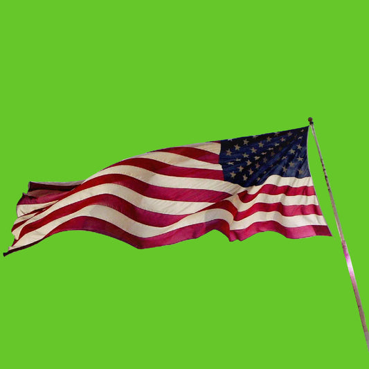 American flag waving against a cloudy sky with stars.