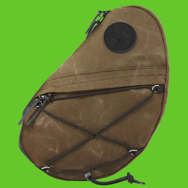 Brown sling bag with black straps on a white background