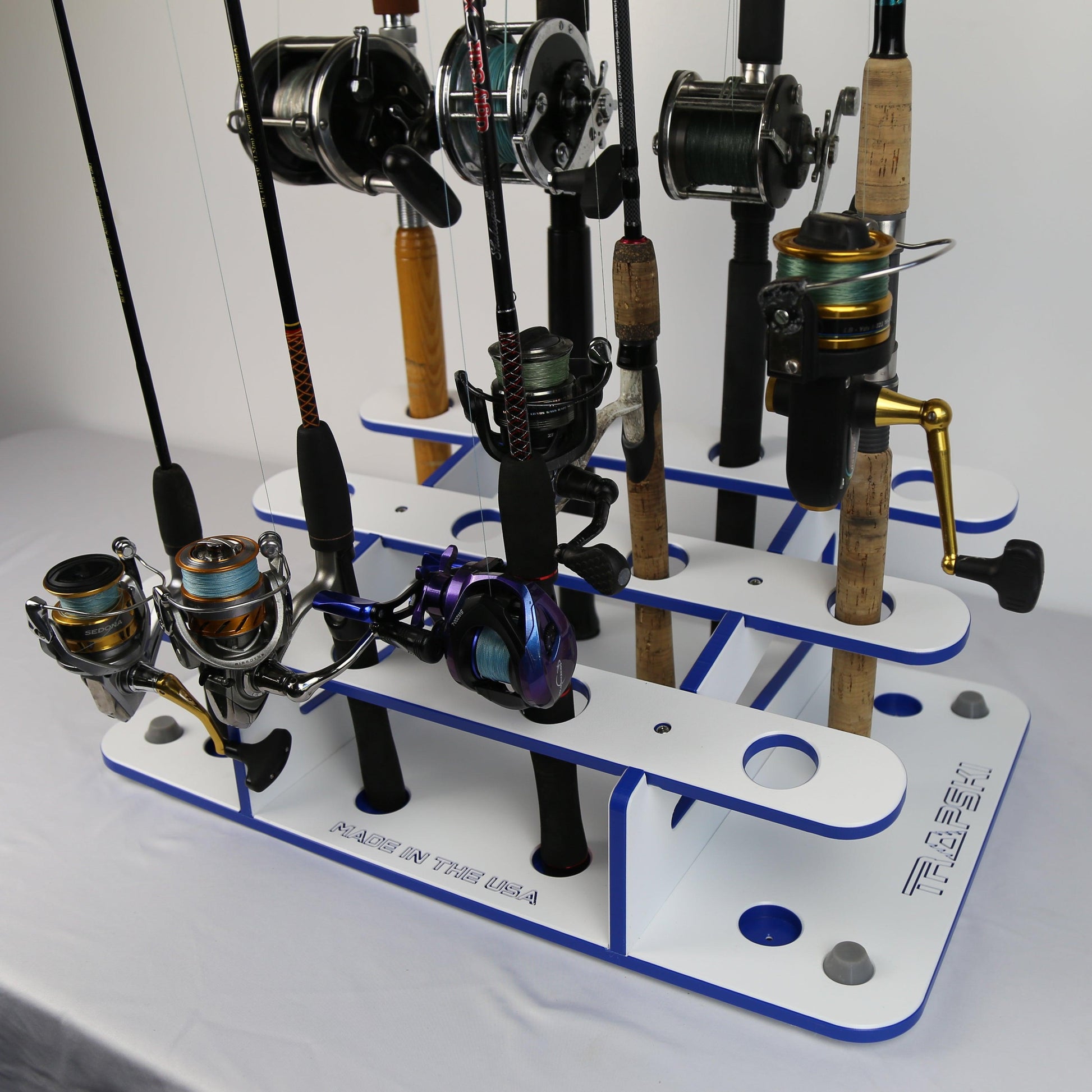 Fishing rod and reel holder with multiple fishing rods on a white background