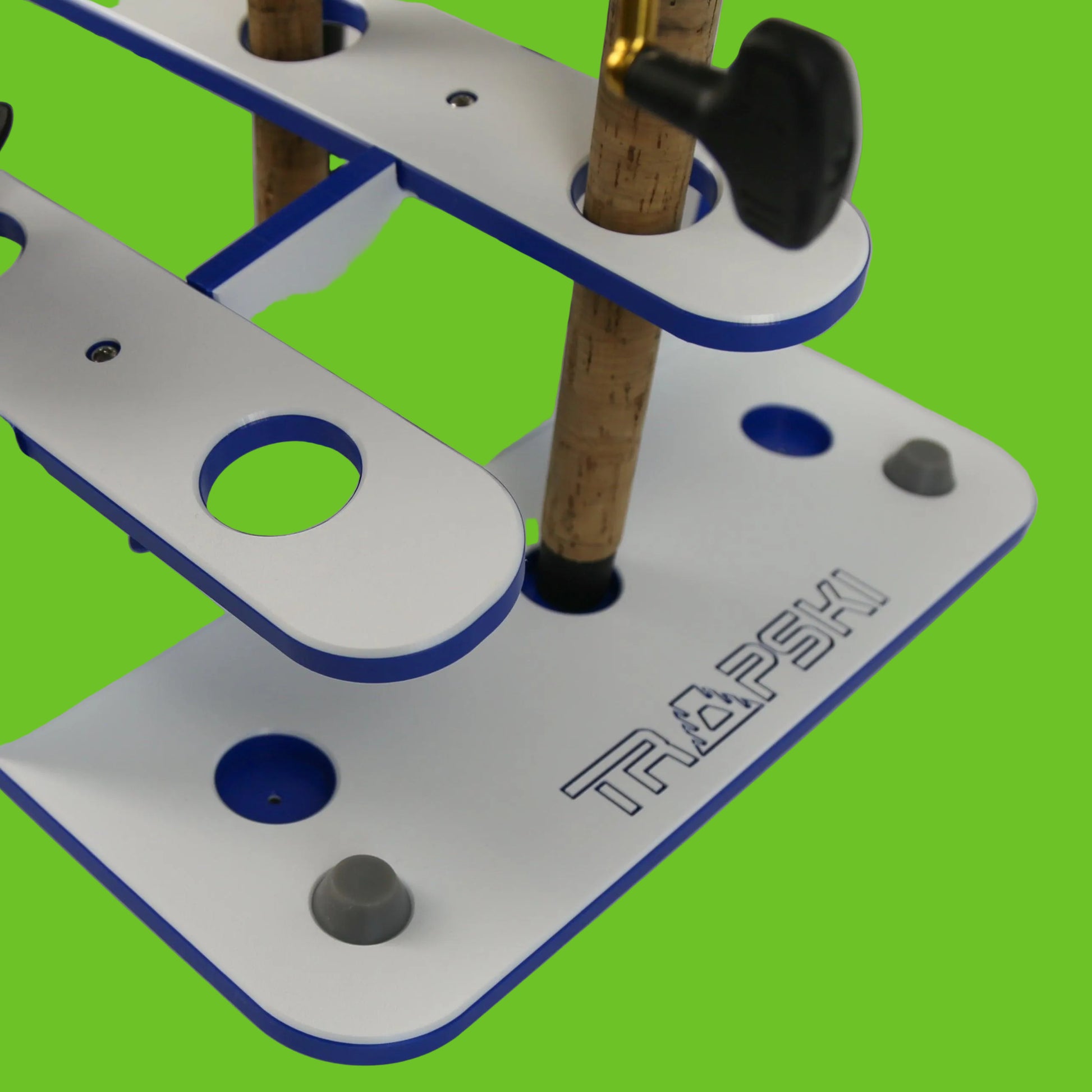 Close-up of a fishing rod holder with wooden rods on a white background