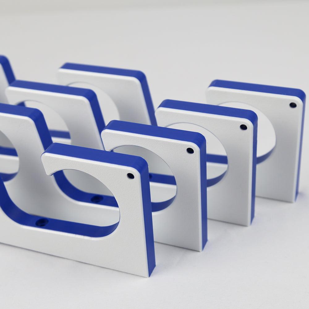 White and blue geometric wall art pieces on a light gray background