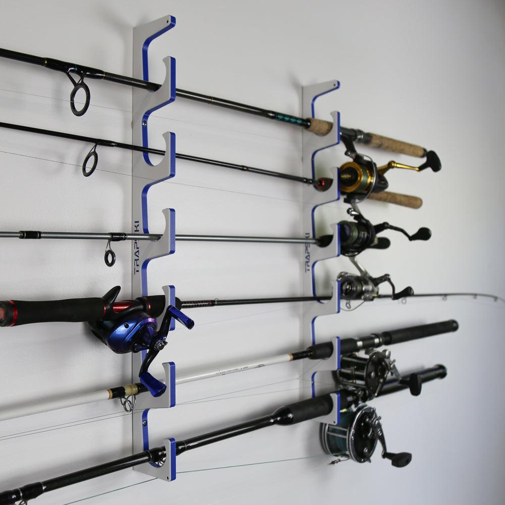 Fishing rod holder with multiple fishing rods and reels on a white wall.
