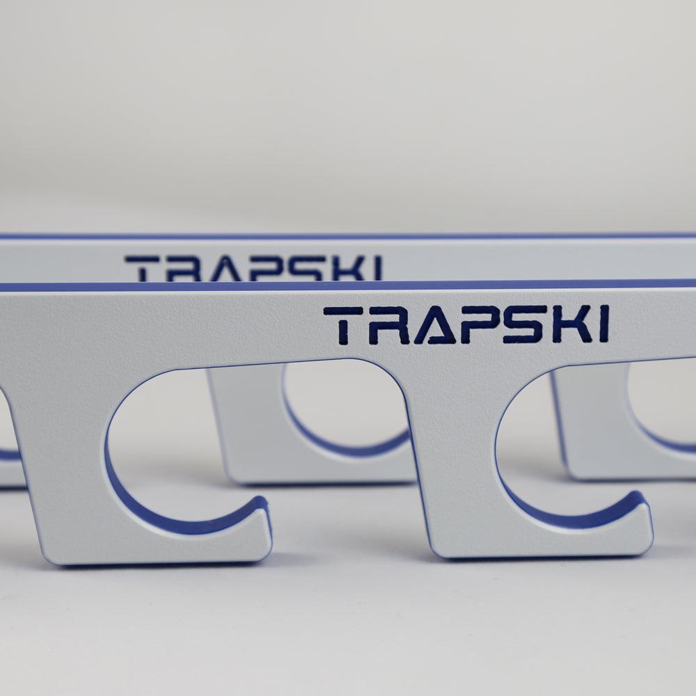 Metallic object with 'TRAPSKI' branding on a gray background