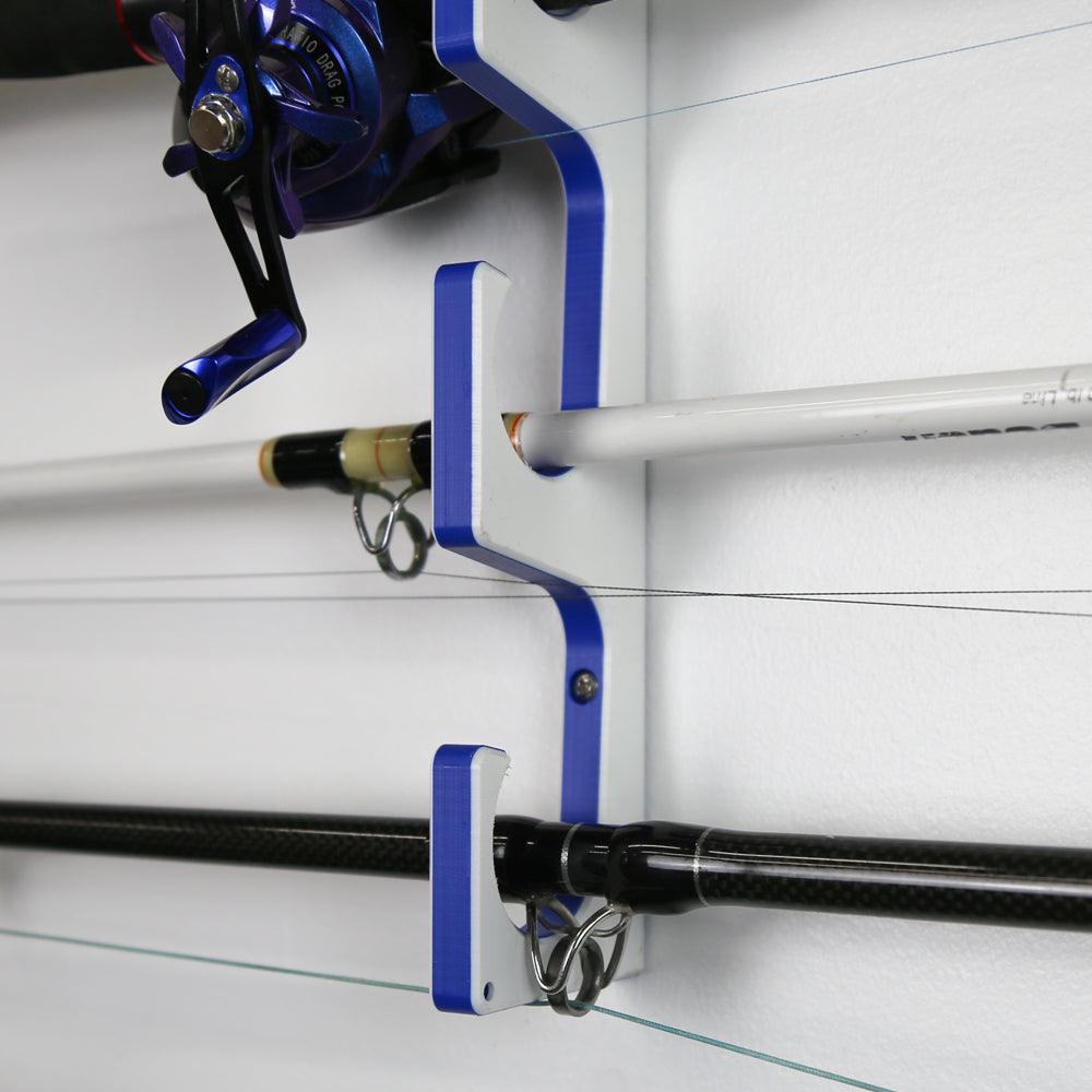Fishing rod holder with multiple rods on a white wall