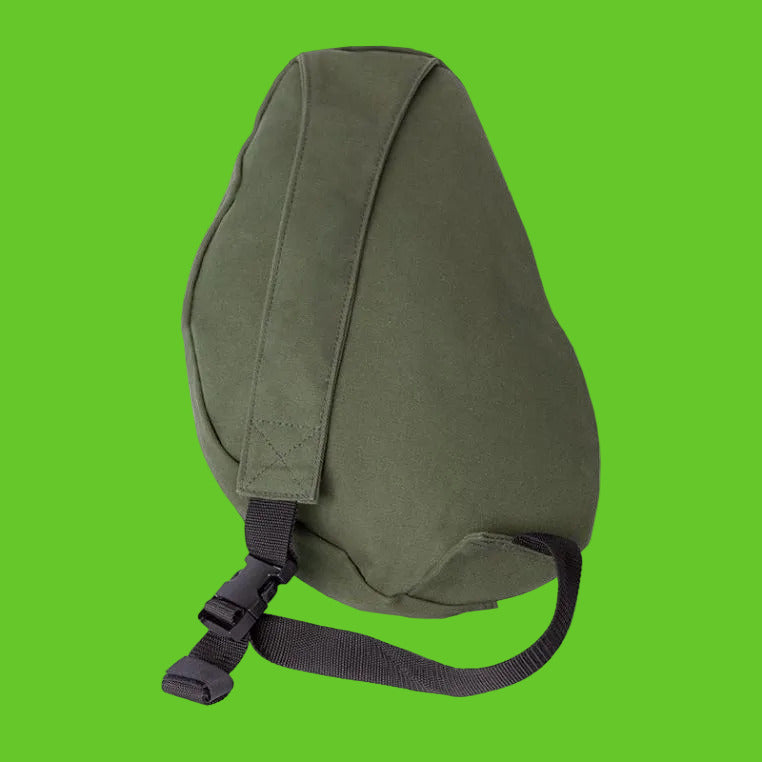 Green backpack with a strap on a white background