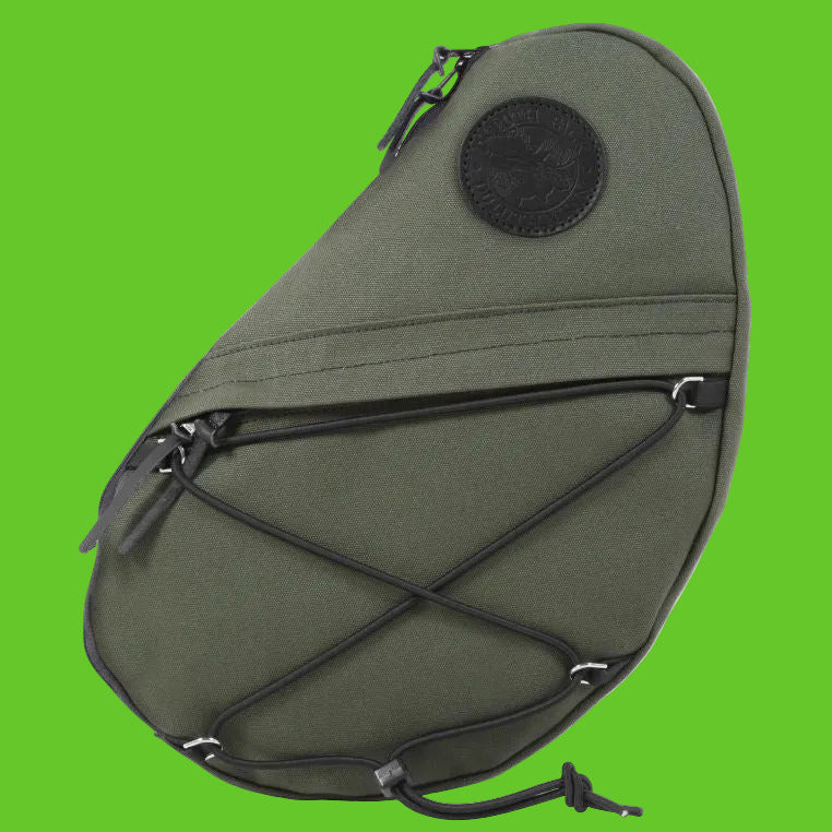 Green sling bag with black straps on a white background