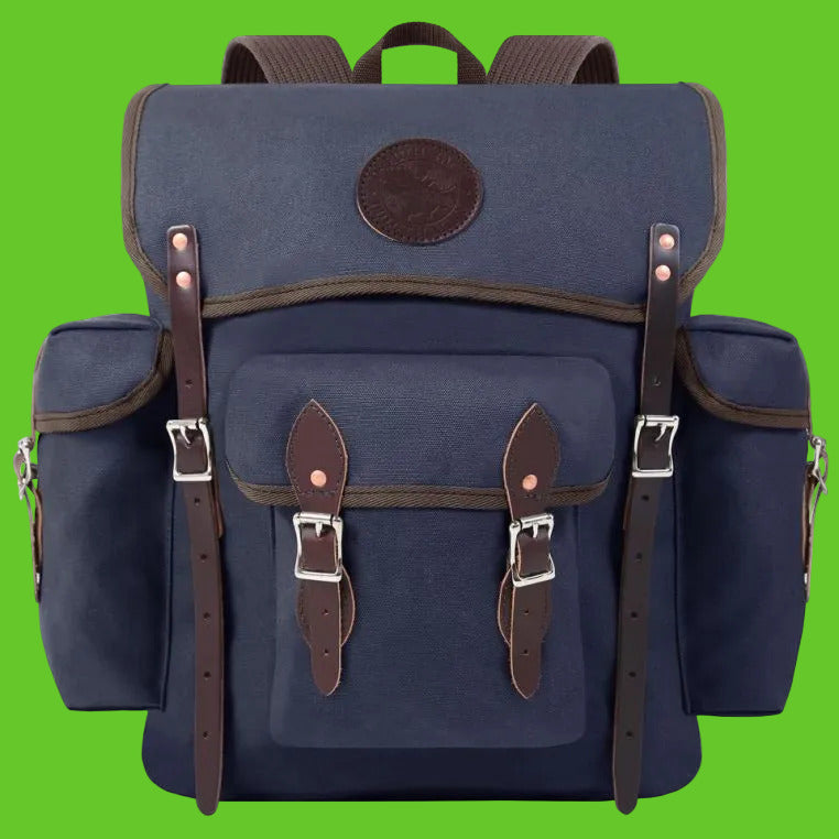 Blue backpack with brown straps and leather accents on a white background